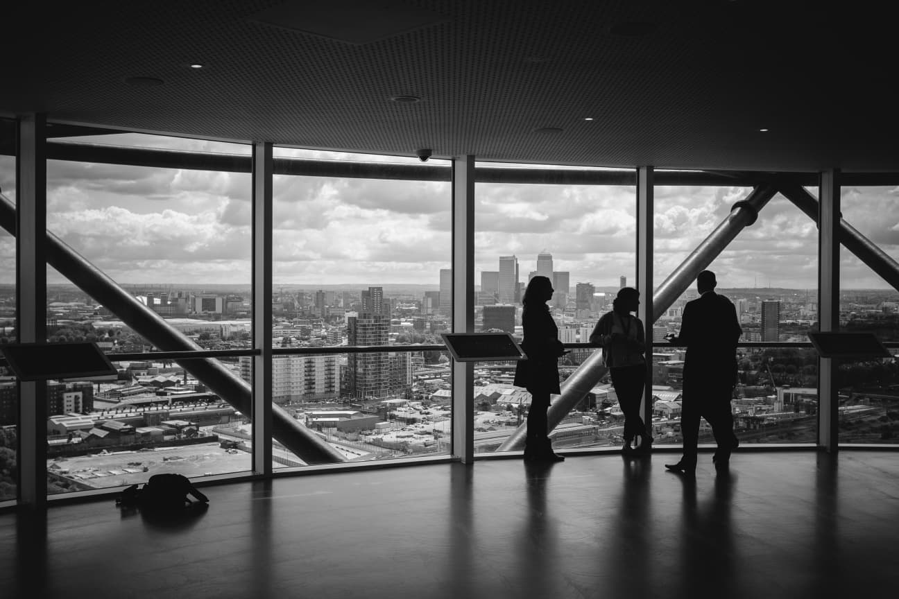 Leaders in conversation inside a contemporary meeting space