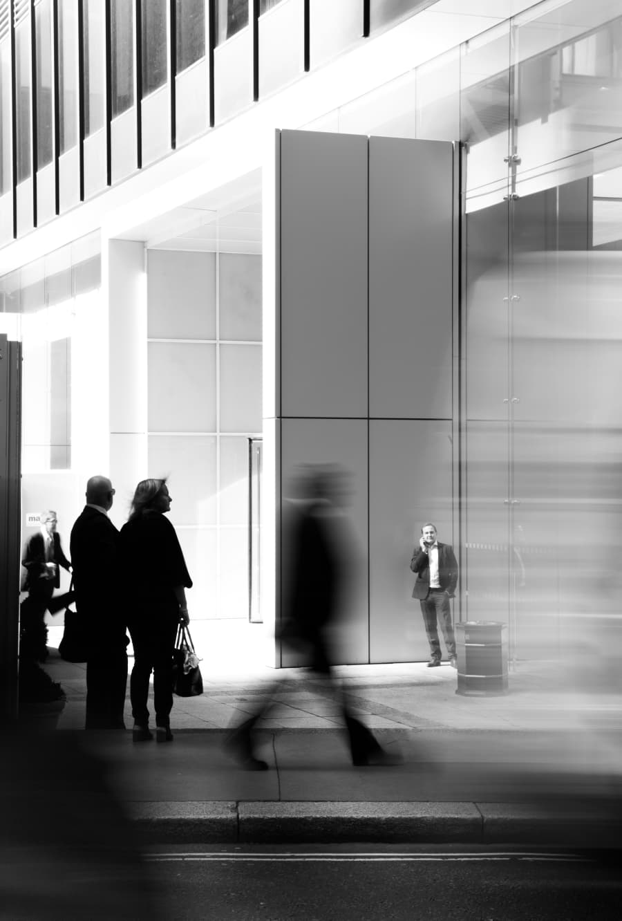 People moving through a contemporary institutional space